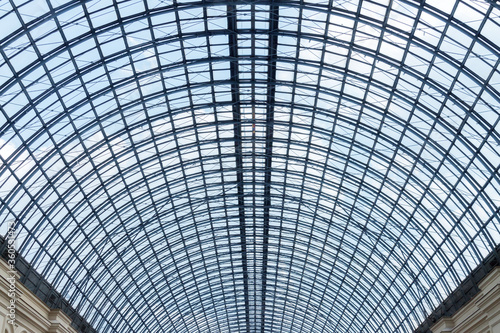 Round glass roof of moden building with metal geometric pattern frame