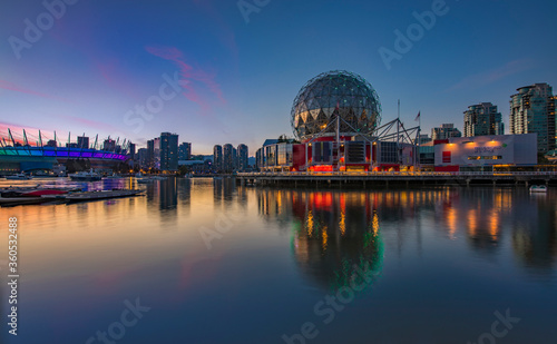 Iconic Science World at sunset blue hour with reflections in the water in Vancouver Canada