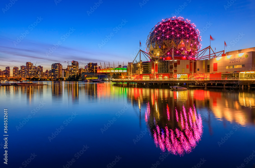 Fototapeta premium Iconic Science World at sunset blue hour with reflections in the water in Vancouver Canada