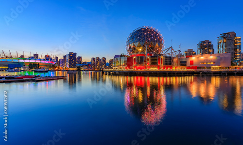 Iconic Science World at sunset blue hour with reflections in the water in Vancouver Canada