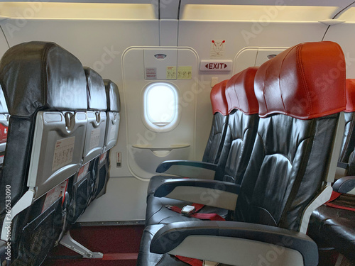 Emergency exit window in aircraft cabin. Long leg room seat. premium seat. Emergency exit seat. photo