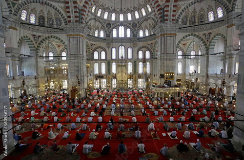 Worshippers, wearing face masks to prevent against Coronavirus, COVID-19 outbreak, attends the communal Friday prayers in Fatih mosque, Istanbul, Turkey.