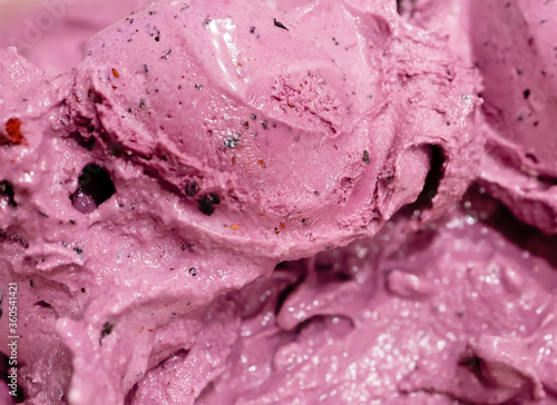 Tasty fresh blueberry ice cream, pink and purple color and creamy texture as background.