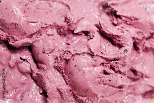 Tasty fresh blueberry ice cream, pink and purple color and creamy texture as background.
