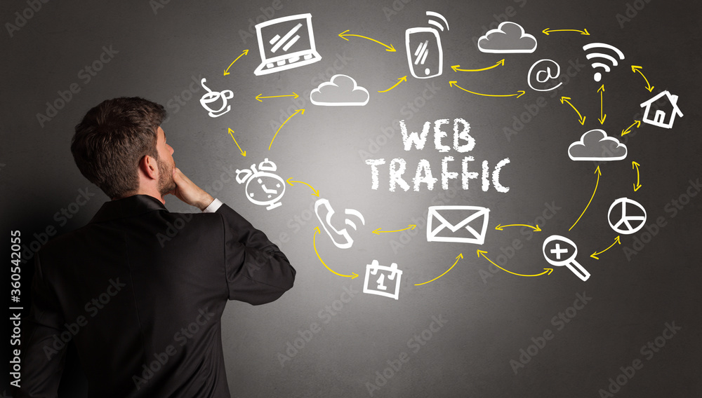 businessman drawing social media icons with WEB TRAFFIC inscription, new media concept businessman drawing social media icons with WEB TRAFFIC inscription, new media concept