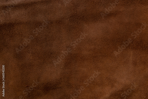 dark brown natural suede as a background close-up