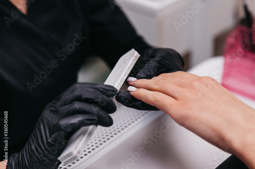 manicurist works with a nail file © Porokhniak Valentyn