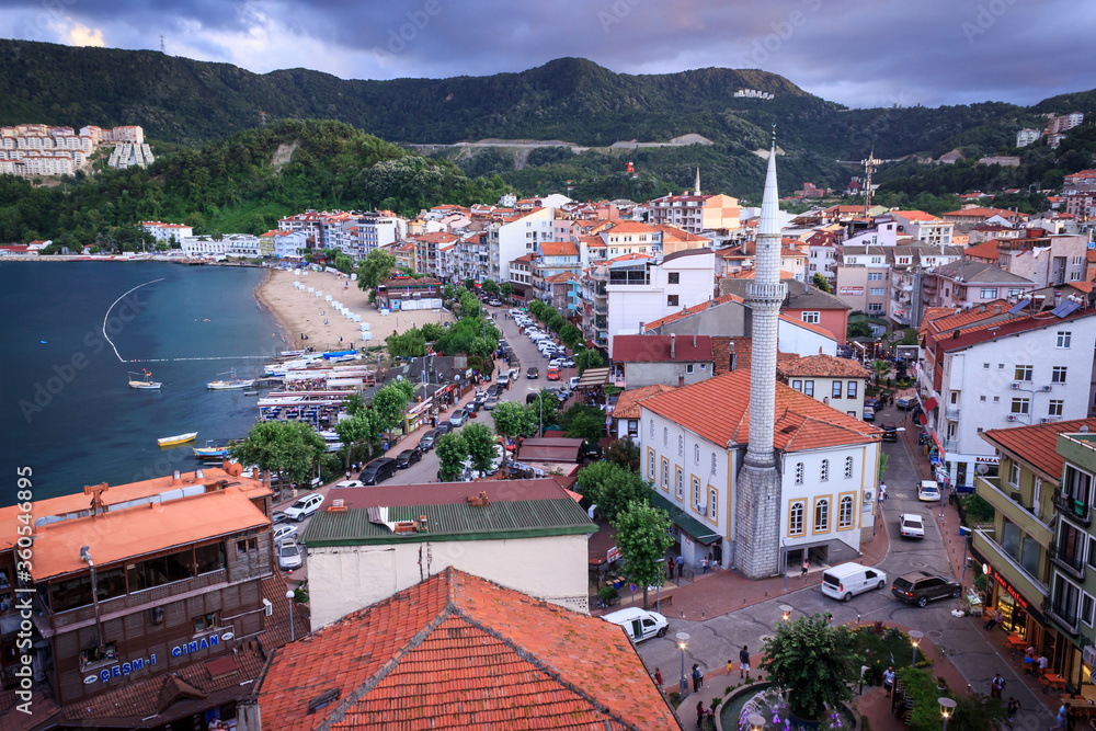 Amasra city center at evening time. Natural sea, mountain and city landscape at blue hour. Scenery view of historical Amasra town.