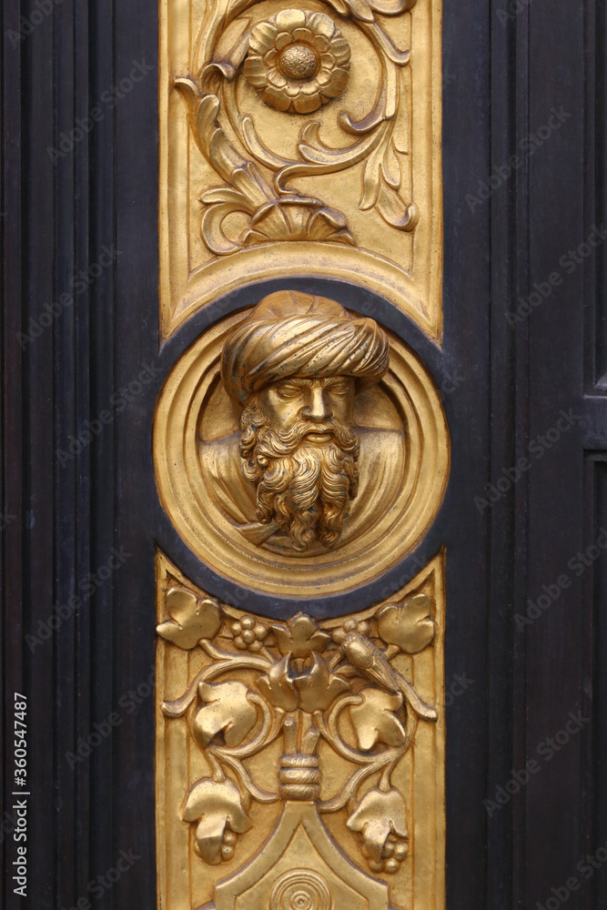 Gate of Paradise bronze sculpture details, baptistery of Florence, Italy, famous touristic place Gate of Paradise bronze sculpture details, baptistery of Florence, Italy, famous touristic place