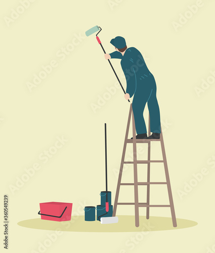 Handyman on a ladder painting a wall. Professional painter