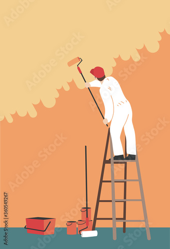 Handyman on a ladder painting a wall. Professional painter