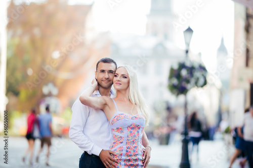 Beautiful couple in love dating outdoors and smiling