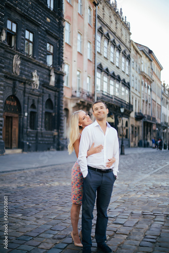 beautiful couple on city background posing, full height © ostap_davydiak