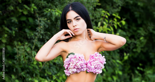 Sensual woman, flower bra. Sensual spring girl. Female with flowers. Perfect female body with flowers, sexy underwear. Girl with flowers instead of underwear, flowering