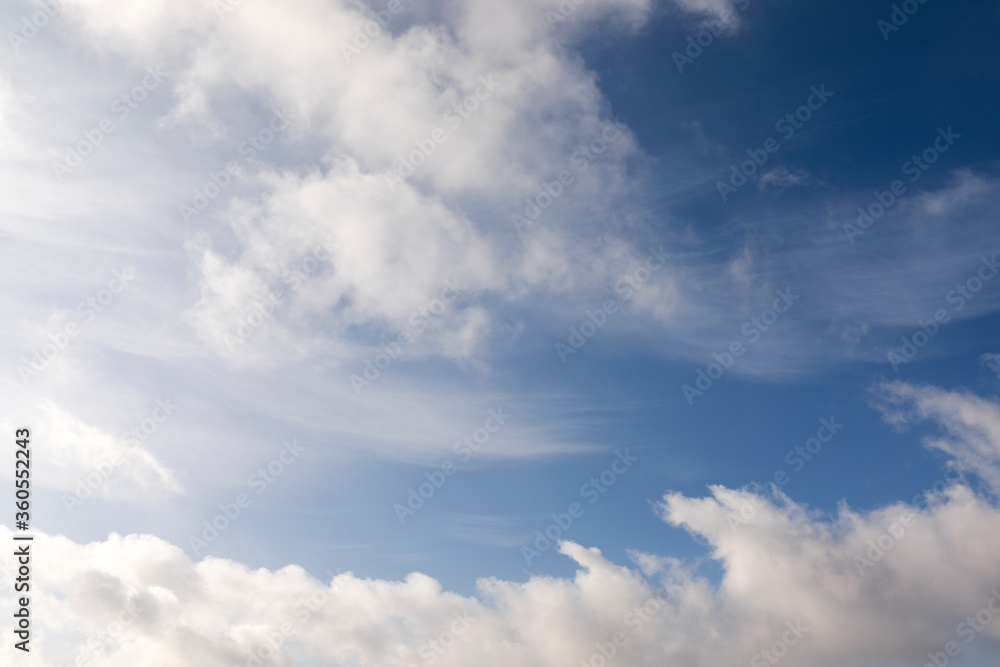 Fototapeta premium Mix of hard and soft white clouds in blue sky
