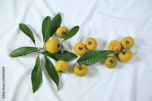 Wallpaper Mural Fresh ripe tasty eggfruits with leaves isolated on white background Torontodigital.ca