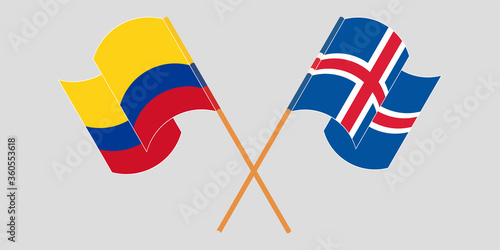 Crossed and waving flags of Colombia and Iceland