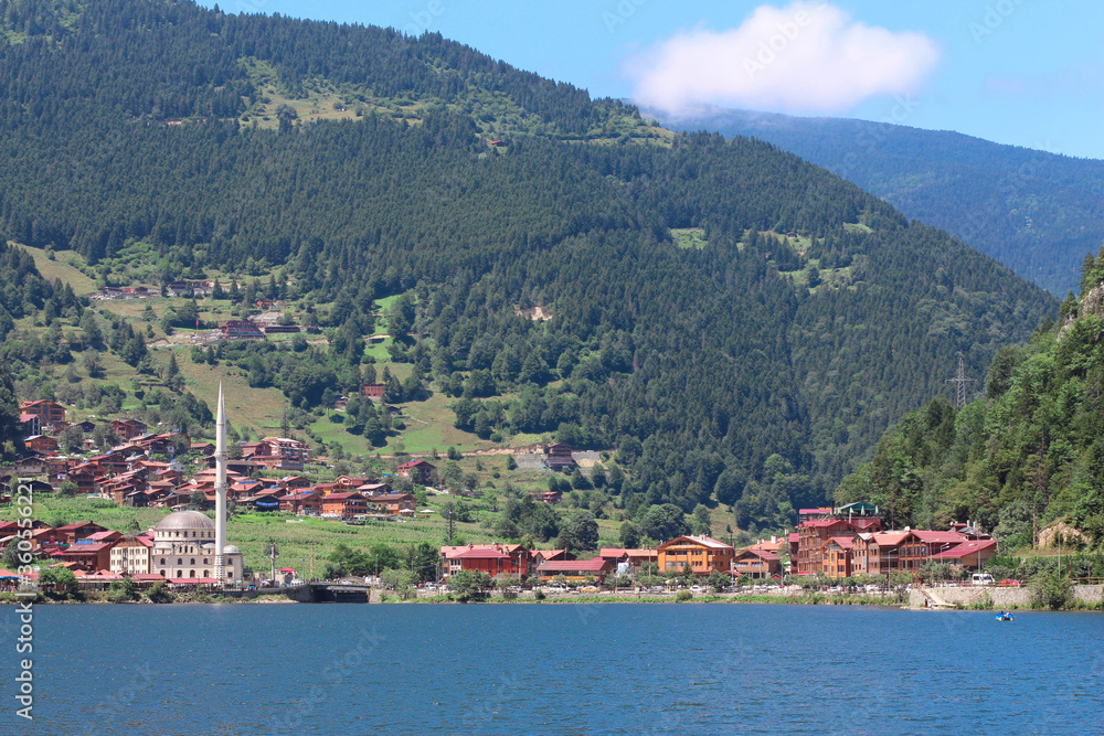 Turkey, Trabzon, Uzungol. Mosque on the lake. Lake across the mountain. National park. Nature background.