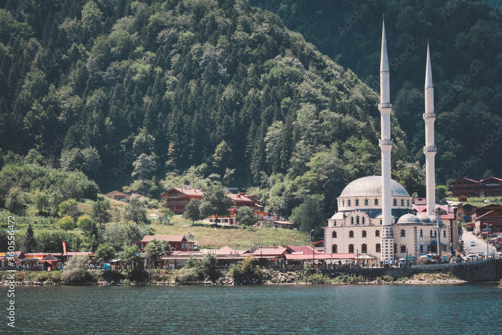Turkey, Trabzon, Uzungol. Mosque on the lake. Lake across the mountain. National park. Nature background.