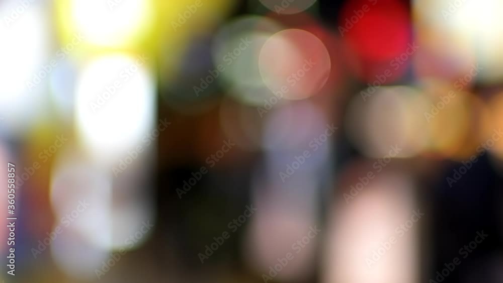 Tokyo, Japan Shinjuku district at night with abstract blurry blurred background of bokeh lights on street panning urban nightlife in slow motion Tokyo, Japan Shinjuku district at night with abstract blurry blurred background of bokeh lights on street panning urban nightlife in slow motion