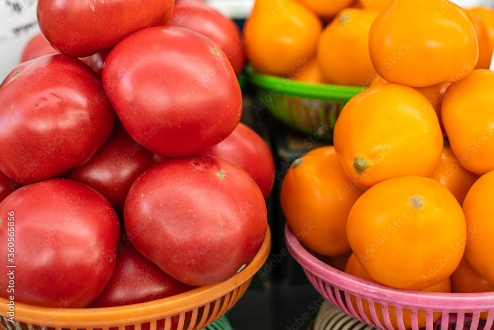 Beautiful picture of red and white tomatoes sold on the market Beautiful picture of red and white tomatoes sold on the market