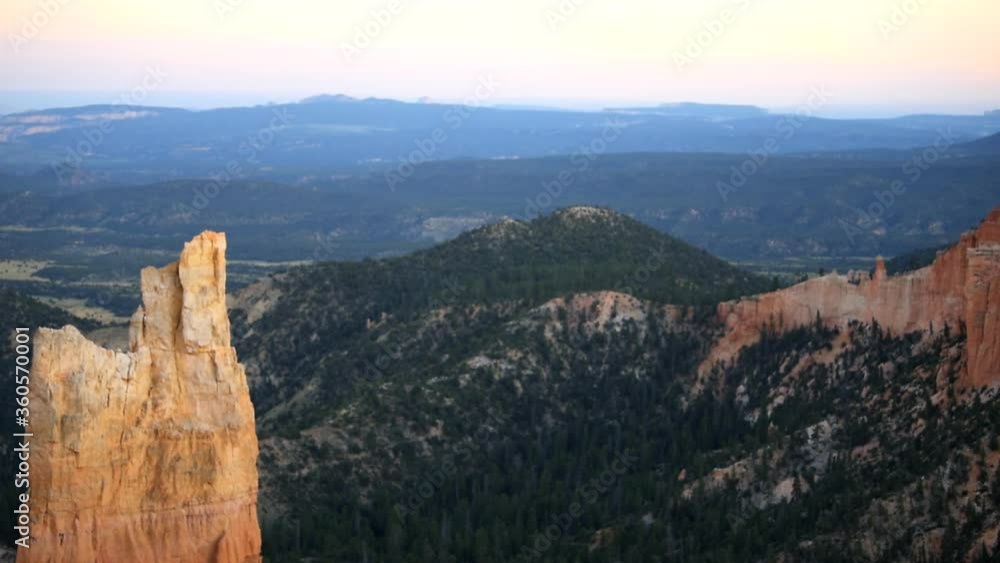Paria view overlook of orange pink cliff rock in Bryce Canyon National Park in Utah at dark sunset twilight and sunlight on formation Paria view overlook of orange pink cliff rock in Bryce Canyon National Park in Utah at dark sunset twilight and sunlight on formation
