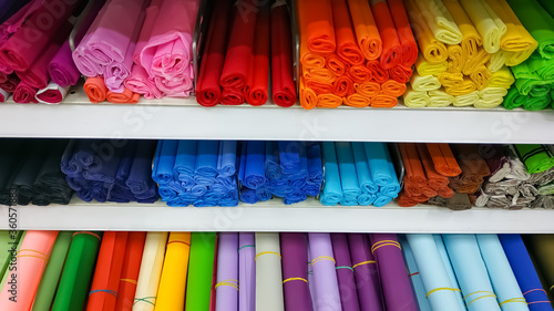 rolls of colored craft paper whatman and foamiran in the store on the shelves