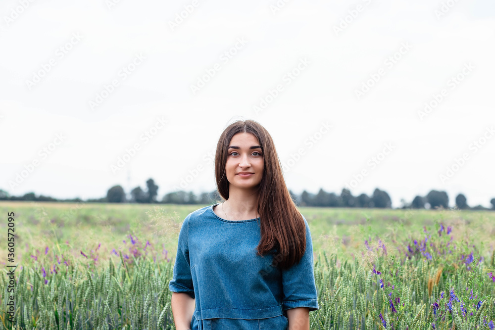 Portrait of a girl in a wheat field. Portrait of a beautiful girl in a wheat field. Portrait of a girl in a wheat field. Portrait of a beautiful girl in a wheat field.