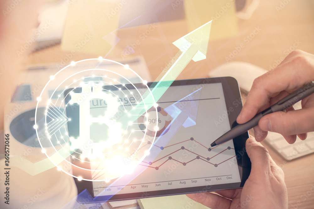 Double exposure of man's hands holding and using a phone and crypto currency blockchain theme drawing. Double exposure of man's hands holding and using a phone and crypto currency blockchain theme drawing.