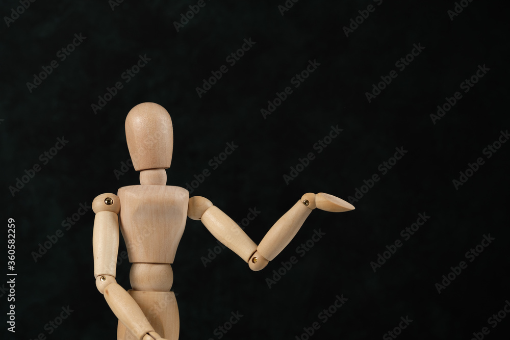 Handcrafted wooden man figure mannequin model dummy doll on background. Copy space. Handcrafted wooden man figure mannequin model dummy doll on background. Copy space.