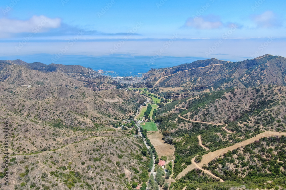 Aerial view of Santa Catalina Island mountains and trails with ocean on the background. California, USA