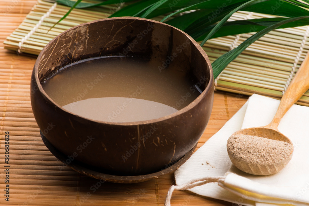 Kava drink made from the roots of the kava plant mixed with water - obrazy, fototapety, plakaty 