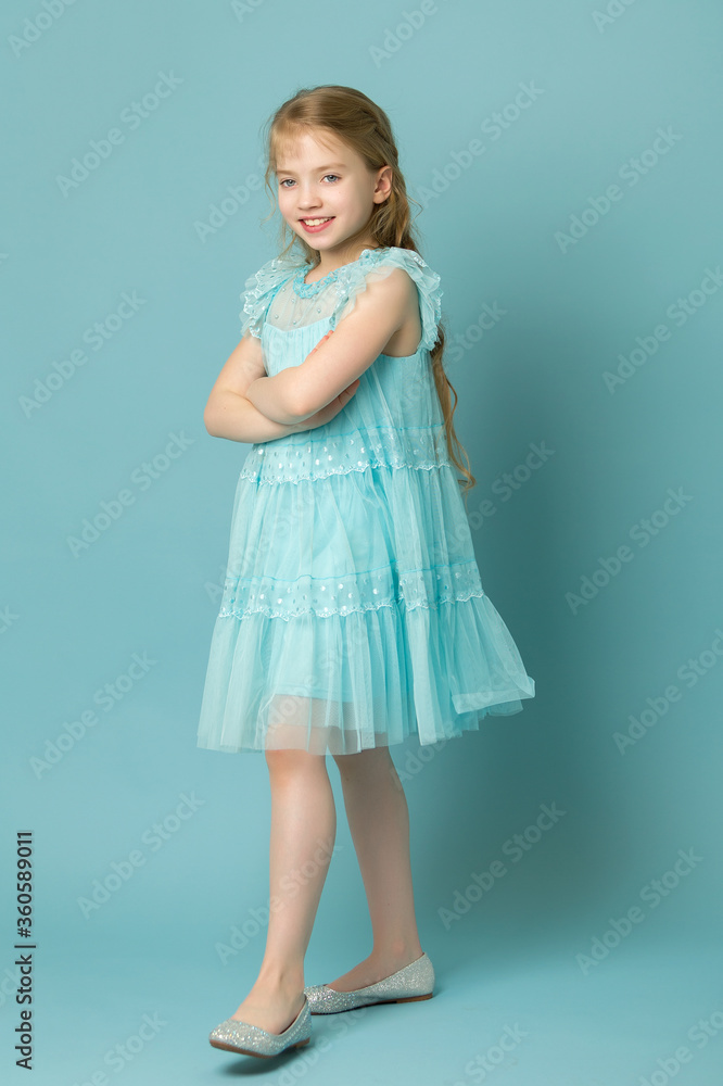 Elegant girl in a dress. Youth fashion concept, happy child. Elegant girl in a dress. Youth fashion concept, happy child.