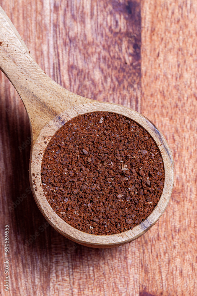 A small spoon of medium coarse arabica coffee A small spoon of medium coarse arabica coffee