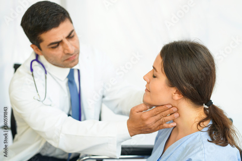 The doctor examined the female patients with neck pain in the hospital.