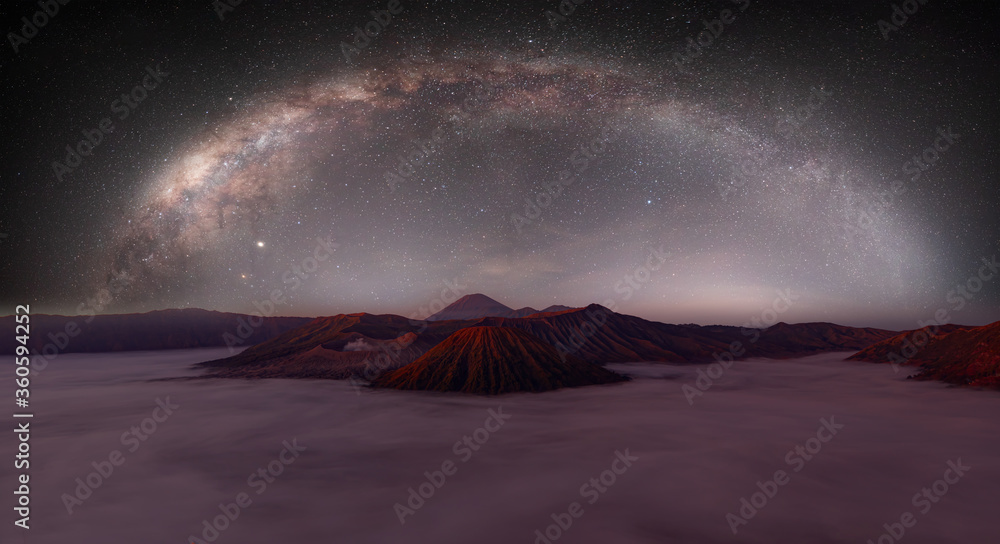 Beautiful night landscape with silhouette of Bromo mountain on the background Milky way galaxy - Bromo Tengger Semeru National Park , Indonesia