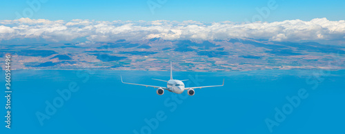 Wallpaper Mural White commercial airplane in the sky  flying over city and sea Torontodigital.ca