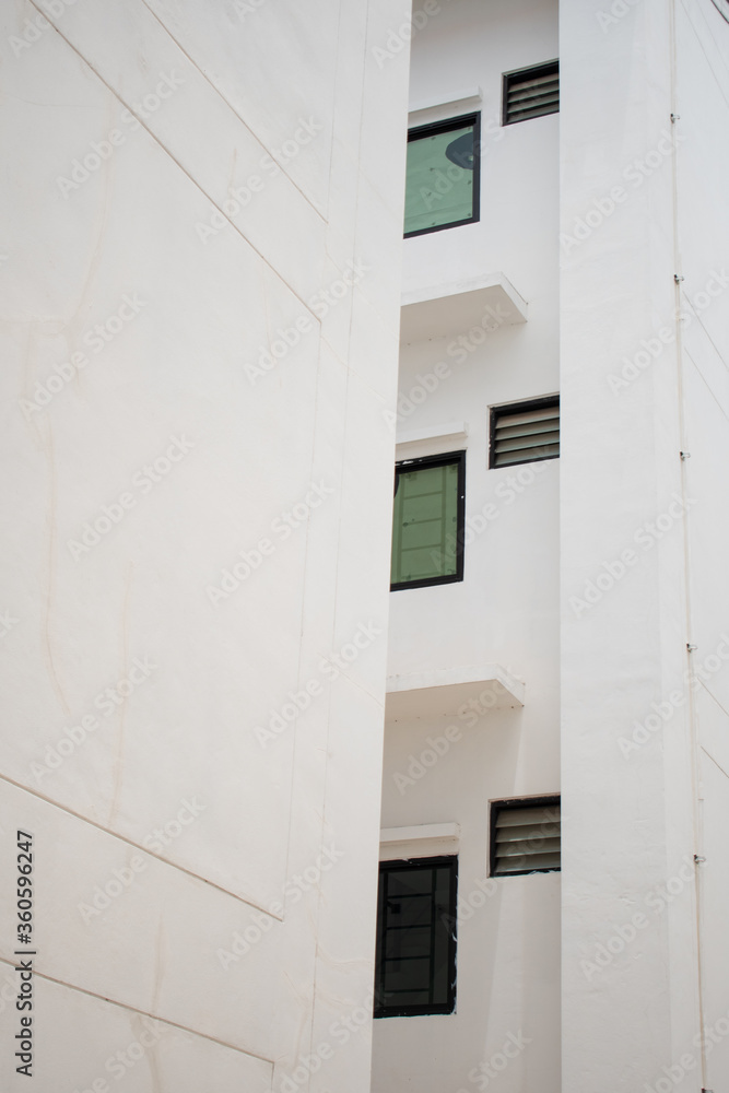 facade of an old building white glass window and white wall