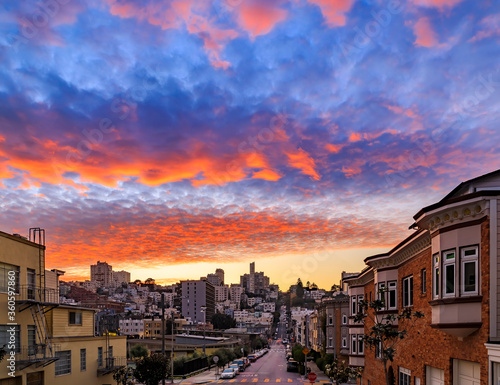High angle view of homes on the famous crooked Lombard Street, San Francisco California with fiery skies at sunset