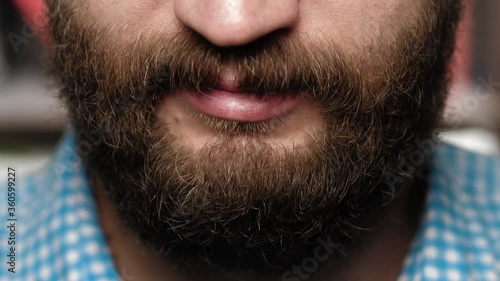 Bearded man says yes. Male head nods head down showing his consent