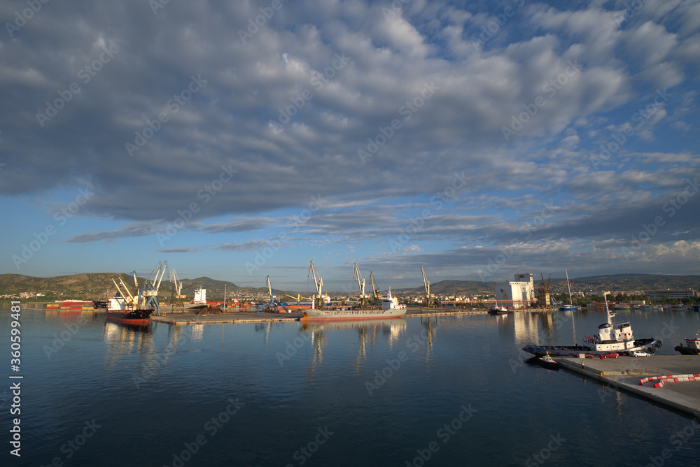 
6/21/2020 Greece, Volos, commercial port east of the sun