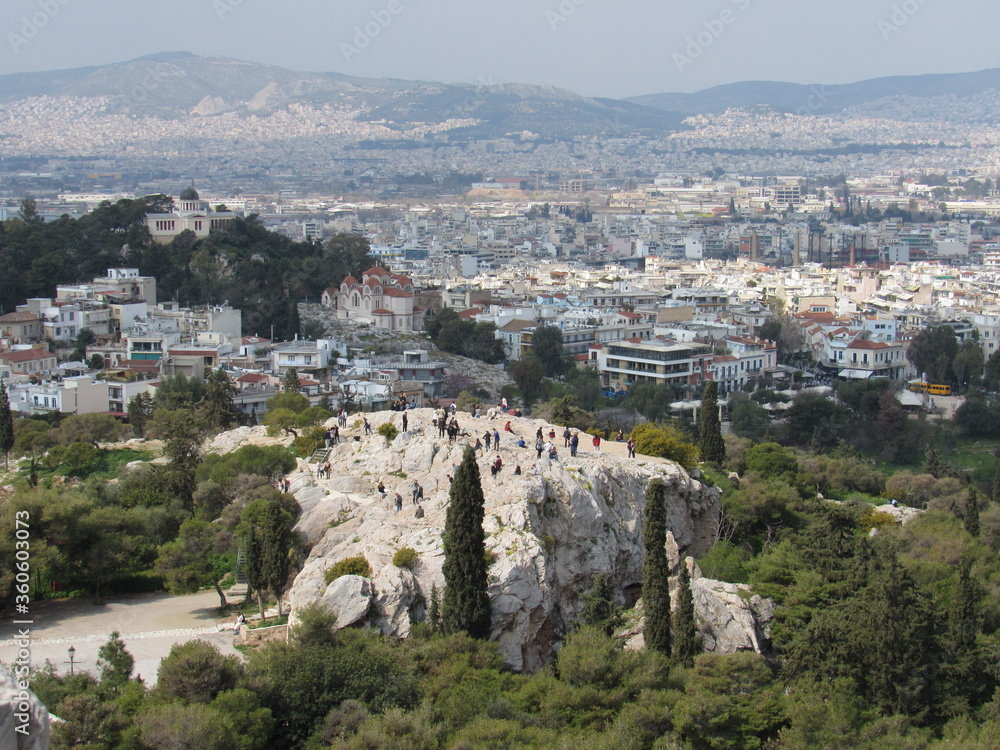 View over Athens from the Acropolis with the Areopagus Hill (or Mars Hill) with many tourists