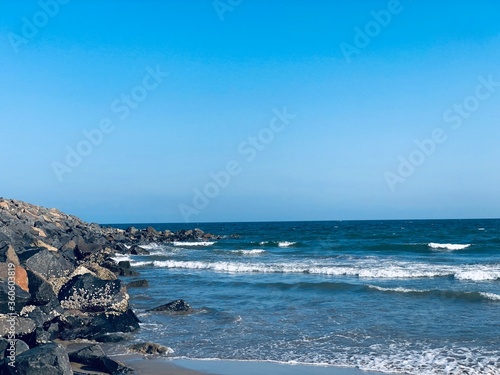 Sea waves on the beach with rocks on the shore at Ennore beach, Tamil nadu © Prabhakarans12