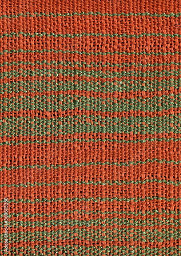 Handwoven striped fabric in orange and green