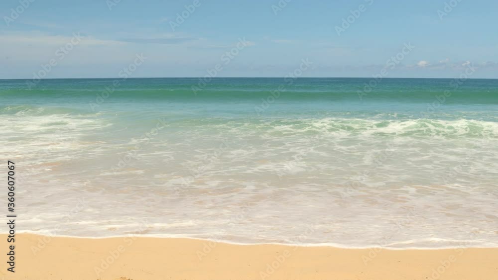 Phuket sea and beach on a clear blue day with strong waves. Phuket sea and beach on a clear blue day with strong waves.