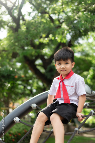 Happy cute little child playing in the park outdoors