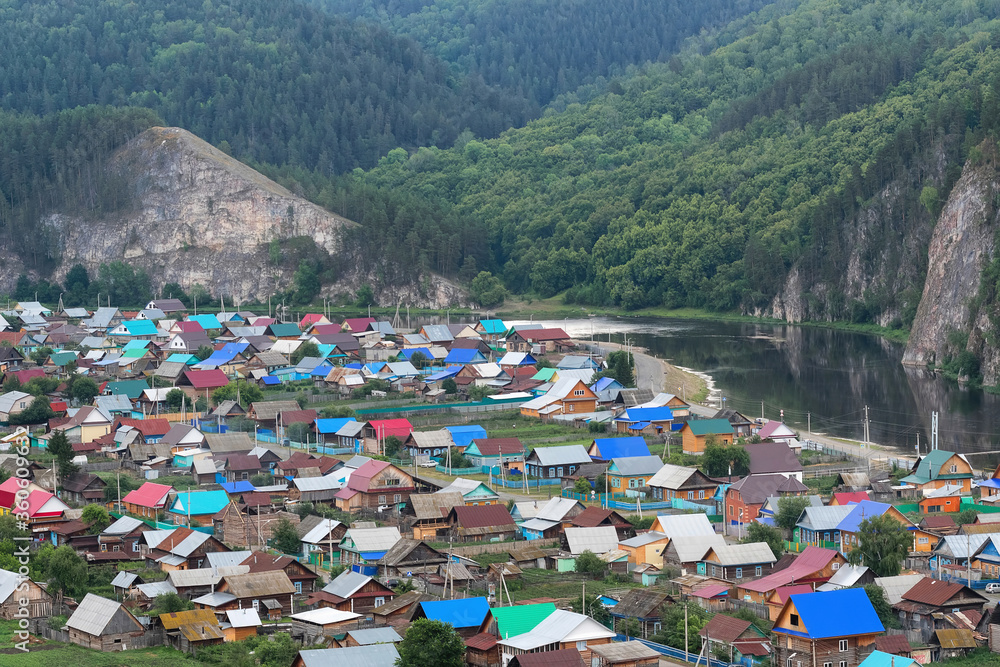 Aerial view of Starosubhangulovo village which located on the bank of Belaya river. Bashkortostan, Ural, Russia.
