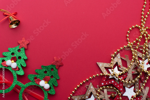 Christmas Headband, Funny Glasses With Green Trees and Wooden Toys on Red Background.