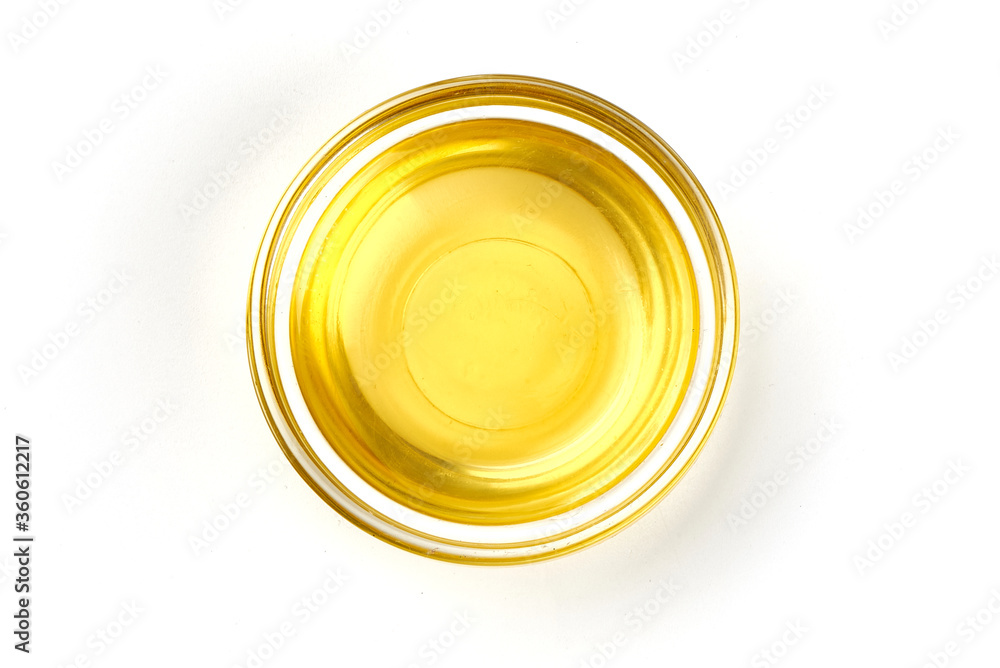 Top view of vegetable or olive oil in a bowl, isolated on white background. Top view of vegetable or olive oil in a bowl, isolated on white background.