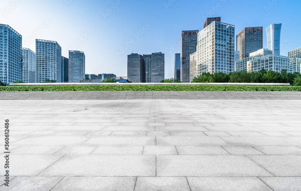 Empty city square road and modern business district office buildings in Beijing, China